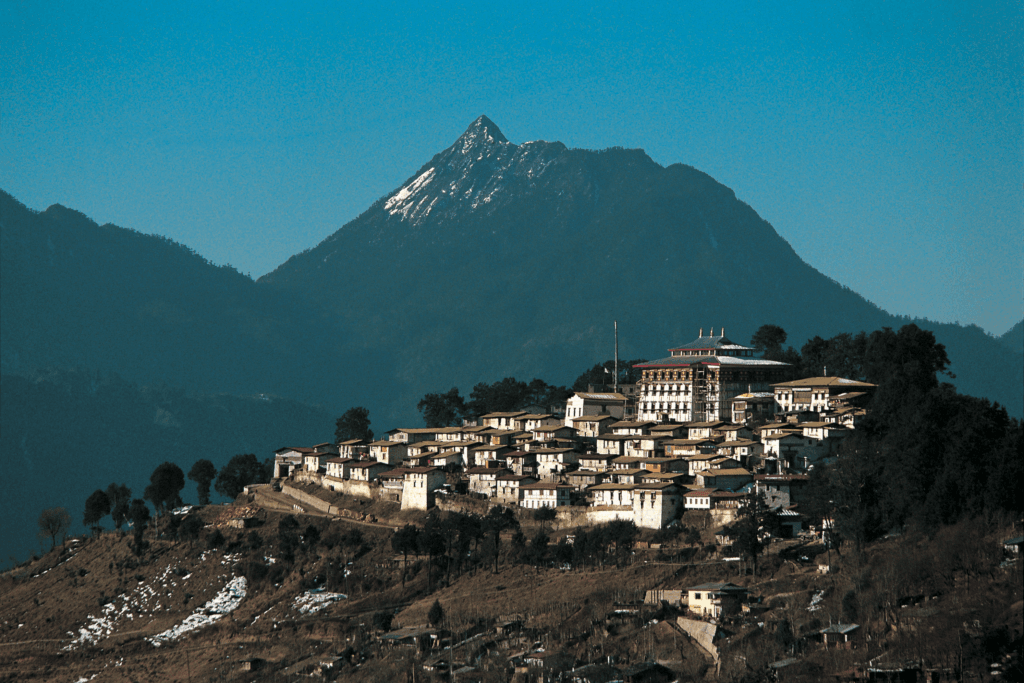 Tawang Monastery on a hilltop surrounded by snowcapped mountains in Arunachal Pradesh