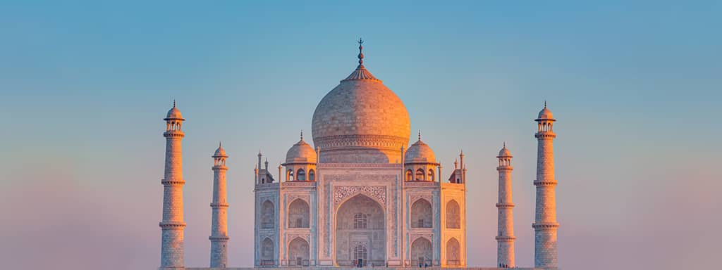 Taj Mahal in India with Sun Setting in Background