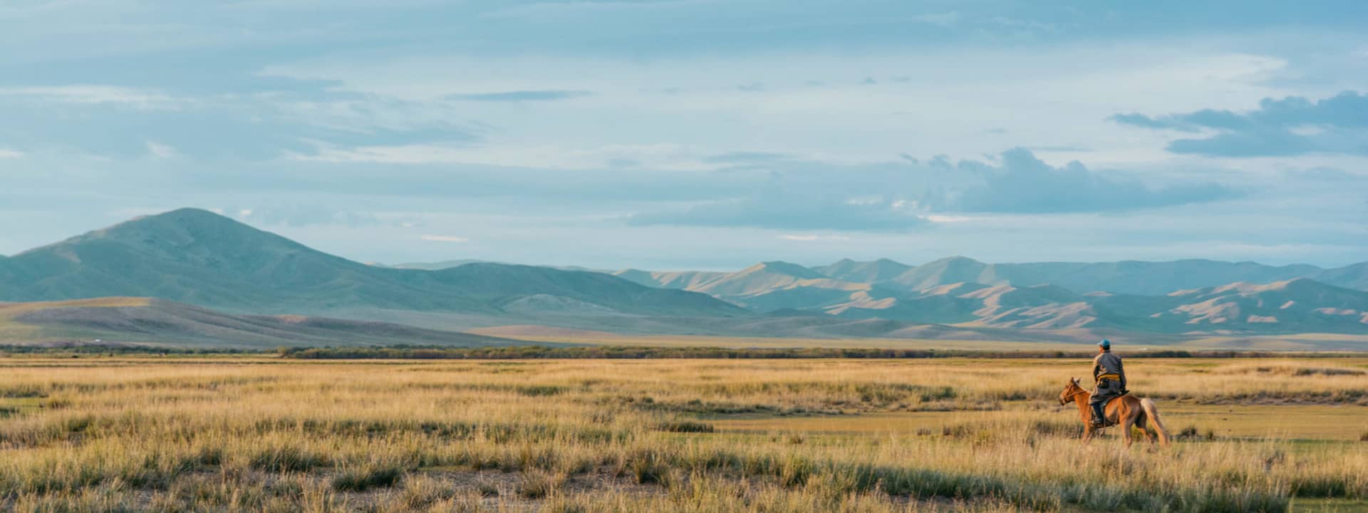 Horse back rider in the Mongolian landscape